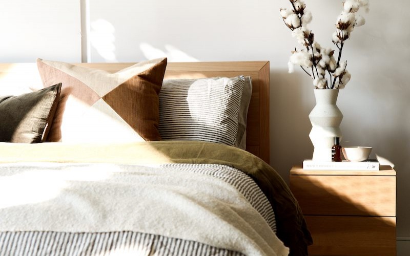 Large well lit bedroom with carpeted floors and a large window